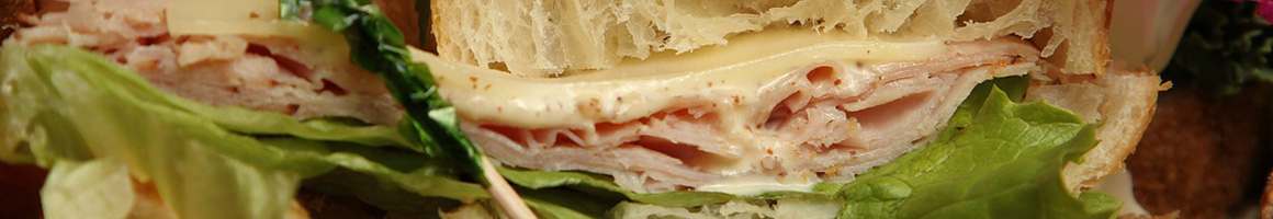 Eating French Sandwich Bakery at Georgia French Bakery & Cafe restaurant in Duluth, GA.